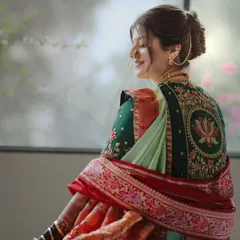 A graceful shot of the bride, her traditional hairstyle adding to the overall picture of elegance.