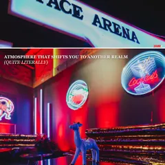 The 'Space Arena' entrance, where neon signs and futuristic decor shifted the atmosphere to another realm. Every element was designed to transport guests to a cosmic celebration.