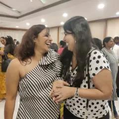 Sharing a moment of pure laughter with one of the event organizers. When the vibe is right, the connections you make are genuine and joyful.