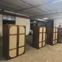 A lineup of the finished wardrobes, showcasing the consistent quality of a large order.