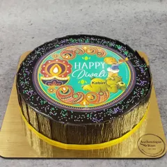 This custom Diwali cake features a vibrant, edible print with a festive diya and paisley design. It's a perfect example of how we can personalize our cakes to become a centerpiece for your family's festival of lights celebration.