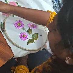From this angle, you can see how the artist's vision comes to life, stroke by stroke. We teach techniques for blending colors and creating depth in your fabric paintings.