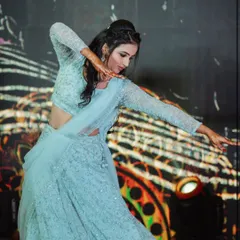 A professional dancer performing a choreographed piece at a Sangeeth. I work with top artists to create performances that align with your event's theme and story.