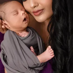 A close-up from a newborn session, focusing on the baby's peaceful expression. I ensure my studio is a warm and safe environment to capture these delicate first moments.