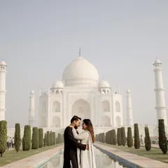 The quintessential Taj Mahal pre-wedding photo, perfectly centered with the reflecting pool. This is a timeless and classic shot that every couple wants, and I ensure it's captured flawlessly.