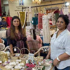 Posing proudly at our stall. You can see some of my macrame wall hangings in the background, along with all the smaller accessories on the table. It was a dream come true to have everything displayed like this.