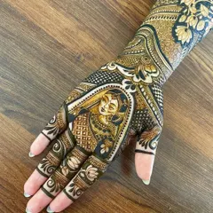 A beautifully detailed portrait of a bride in her wedding attire, drawn on the back of the hand. The use of negative space and shading makes the portrait stand out.