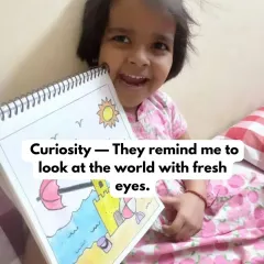 Seeing the world through a child's eyes is a gift. This happy student, holding up her colorful beach drawing, reminds me to always stay curious and find joy in the simple things.