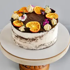 (Hero Media) This Chocolate Orange Naked Cake is one of my absolute favorites to make. It features a soft chocolate sponge, a rich orange-infused dark chocolate ganache, and just a light touch of whipped cream. The candied oranges and fresh flowers make it a beautiful centerpiece for any occasion.