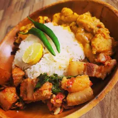 Another angle of this delicious homemade Naga thali, showing the beautiful textures of the different dishes. The combination of spicy pork, fried potatoes, and rice is pure comfort.