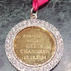 The reverse side of the medallion, engraved with my name. A truly cherished honour.