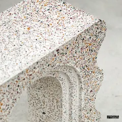 A custom terrazzo art piece made for Muse Lab, designed to be used as a bookshelf. We love the unique curves, the intricate design, and the classic terrazzo selection.