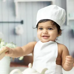 Meet the little chef. Our themed photoshoots are all about fun and imagination, bringing your child's playful personality to life with creative costumes and props.