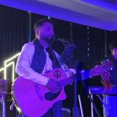 A close-up shot during our New Year's Eve gig. You can see the energy and passion I bring to every performance, especially with the full band backing me up.