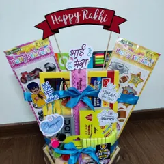 This Rakhi hamper is a dream for any kid who loves stationery. It's filled with putty stickers, a drawing book, color pencils, a ruler, and other fun items, all tied together with a bright blue ribbon and quirky stickers.