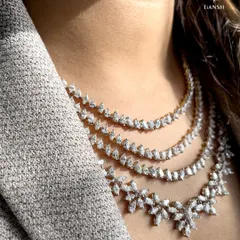 Why choose one layer of sparkle when you can have them all? This layered diamond necklace is designed for the modern woman who loves clean lines and effortless glamour. It is a statement of confidence that is both bold and sophisticated.