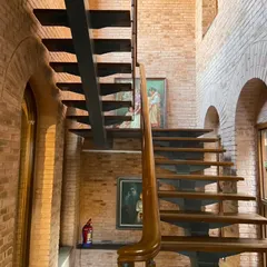 The new public staircase we introduced at the Sister Nivedita Museum. Crafted from steel and wood, its modern form is a deliberate counterpoint to the historic brick walls, creating a clear distinction between the original structure and our intervention.