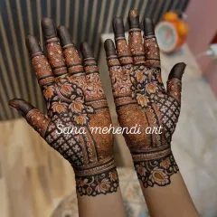 Look at the stunning dark color from my homemade natural henna cone. This full-hand Raksha Bandhan design is filled with beautiful lotus flowers and delicate net patterns, perfect for celebrating with your family.