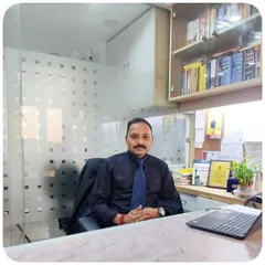 A candid photo in my office. The background with law books and files represents the constant research and preparation that goes into both legal practice and teaching.