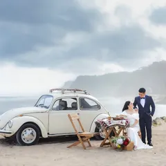 A romantic beachside picnic next to a classic car in Bali. We can style your destination shoot to match any theme, from adventurous to elegantly relaxed.