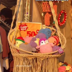This macrame swing is perfect for creating a cozy reading nook. Here, we've filled it with our soft toys to show how versatile it is.