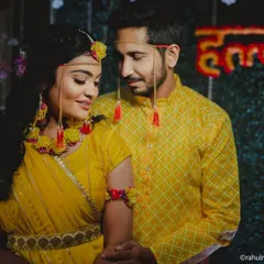 A sweet portrait of the couple during their Haldi ceremony, dressed in matching yellow outfits.
