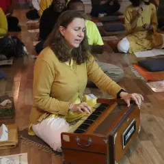 A student plays the harmonium, leading the kirtan during our Maha Shivaratri celebration. Music and chanting are integral parts of our devotional practices, elevating the collective energy.