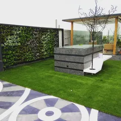 We designed this complete terrace makeover to create a functional and beautiful rooftop escape. The project features high-quality artificial turf for a soft lawn feel, a custom artificial vertical garden for privacy, and a shaded gazebo area for relaxation.