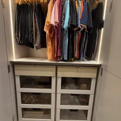 We transformed this closet with a system of glass-front drawers. This allows our client to see the contents of each drawer without opening it, making it easy to find folded t-shirts and other items.