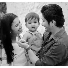 A classic family portrait in black and white. We love capturing these moments of connection between parents and their child.