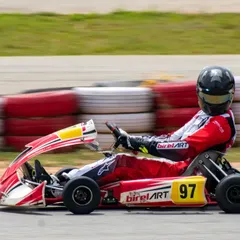 Driver Muktak Joshi in his number 97 kart, navigating a corner with skill. This shot captures the connection between driver and machine that we cultivate.