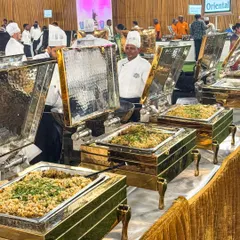 Our chefs at a bustling live chaat counter, preparing plates filled with crunchy, tangy, and flavorful delights. It's a flavor carnival that adds a fun and interactive element to any celebration.