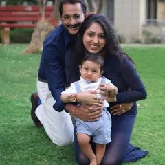 A happy family enjoying a day at the park. Outdoor family photoshoots have a relaxed and natural feel, perfect for capturing genuine smiles and interactions.
