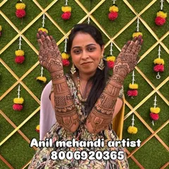 A beautiful client proudly showing her full-arm mehendi. Her smile says it all. I work to make sure every bride feels this happy with her design.
