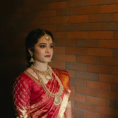 A pensive and beautiful portrait. The makeup enhances her features, creating a look that is both traditional and deeply personal.