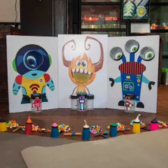 Our monster-themed activity station is ready for action. We set up these colorful, interactive games where kids can feed the monsters, play, and learn simple physics concepts all at once.