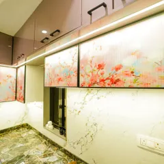 A closer look at the digital fluted glass shutters used in this kitchen. This unique material adds a touch of color and artistry, elevating the design of the overhead cabinets.
