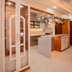 A beautiful pooja unit with fluted glass doors, intricate handles, and internal lighting, creating a divine and elegant focal point in the home.
