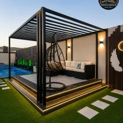 A luxurious rooftop lounge designed for evening relaxation. This pergola features a comfortable L-shaped sofa, a modern swing chair, and dramatic uplighting, creating a sophisticated and inviting atmosphere.
