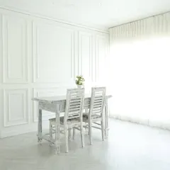 This is the heart of my studio: an all-white, elegant space filled with natural light. The paneled walls, distressed furniture, and sheer curtains create a perfect canvas for everything from classic portraits and lookbooks to clean product photography.