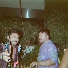 A film photo capturing a fun, unposed moment between friends at one of my events. This is the community vibe I strive to create.