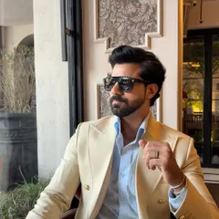 A portrait of refined style. This close-up highlights the jacket's construction and the client's confident demeanor, embodying the aspirational lifestyle our brand represents.
