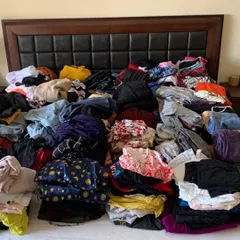 This is what a closet can look like before we start the decluttering process. It's overwhelming and makes it hard to see what you actually have.