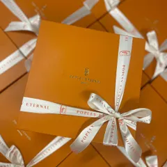 A great example of our custom branding work for a client. We designed these elegant corporate gift boxes with custom logo ribbons for Popley Eternal, ensuring their brand was front and center. I love making sure every detail, from the box to the bow, reflects your company's style.