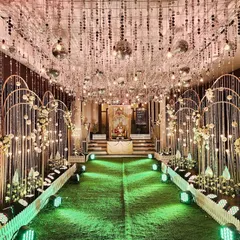 For a night of glamour and dancing, I designed this shimmering silver-themed Sangeet entrance. The ceiling is covered in disco balls and crystal strings, creating a dazzling effect that sets the perfect mood for a high-energy party.