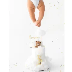 Our blessing. A creative shot from my son Ivaan's 6-month photoshoot, featuring his little legs dangling over the half-birthday cake.