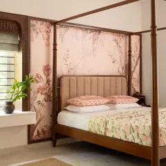 This master suite in 'Project Varnika' is defined by a stunning four-poster bed and custom floral wallpaper. I used soothing pastels and rich wood to create a romantic and timeless retreat.