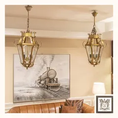 My vintage-style pendant lanterns add a touch of heritage and charm to this living space. The intricate brass frame and clear glass panels are ideal for creating focused, yet gentle, illumination over seating areas or in entryways.