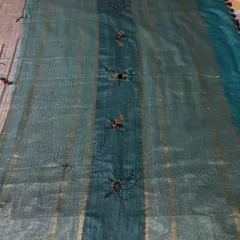 Another view of this beautiful custom piece, showing how the light catches the texture of the fabric and the embroidery.