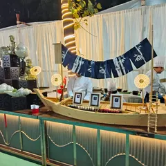 To create a real "wow" moment, I designed this custom sushi boat station. It serves as a stunning centerpiece and offers guests a selection of freshly prepared sushi, bringing a touch of Japanese elegance to the event.
